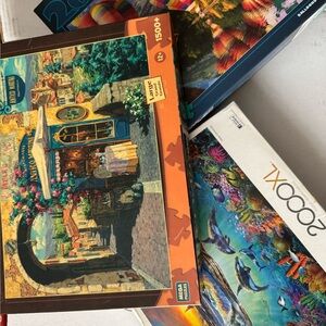 3 Lg puzzles 1500pc Antico Martini, 2000pc Balloons in flight, 2000pc dolphin